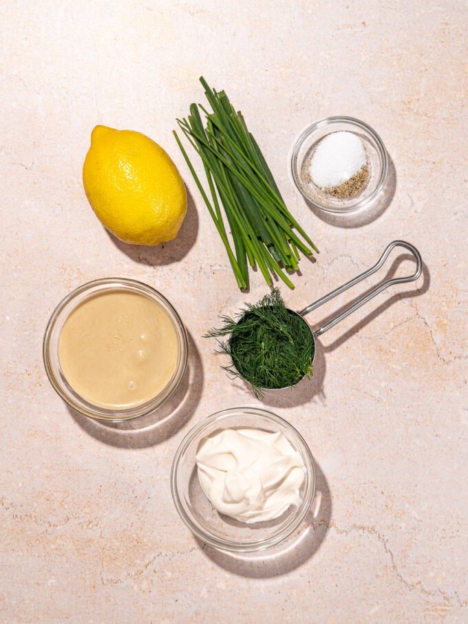 chives, dill, lemon, salt, tahini, mayo in bowls
